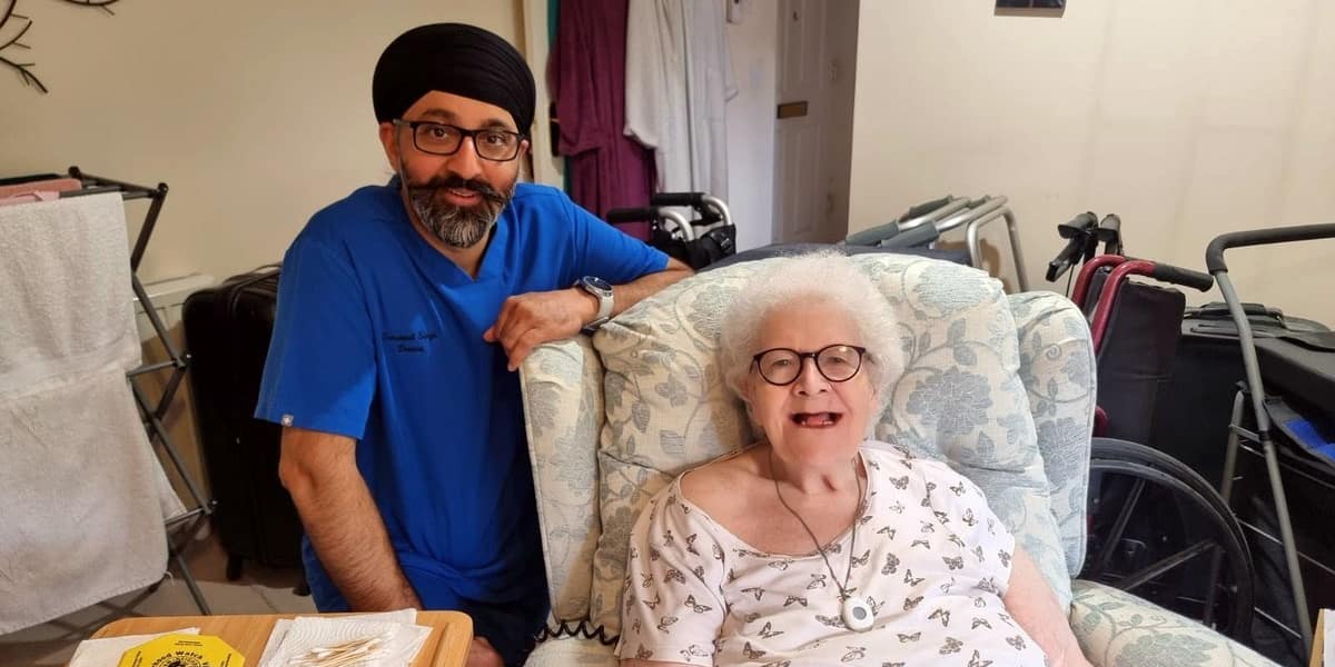 Home visit dentist caring for a patient at home in Liverpool