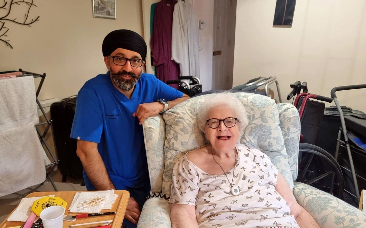 Home visit dentist providing dental care to a patient at home in Liverpool